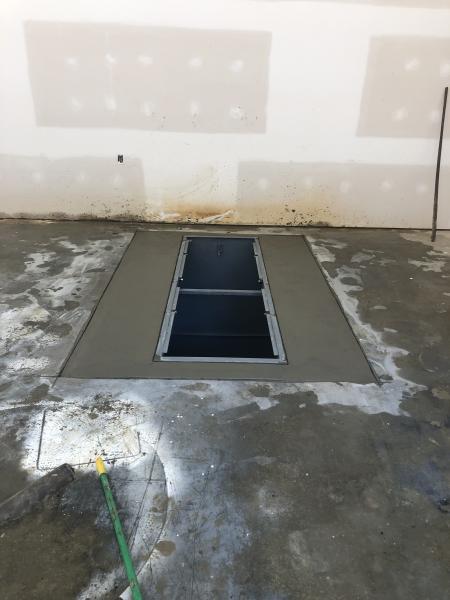 Newly Installed Underground Storm Shelter In Garage